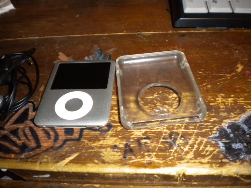 ipod nano 3rd generation silver. $50 with ipod and case,
